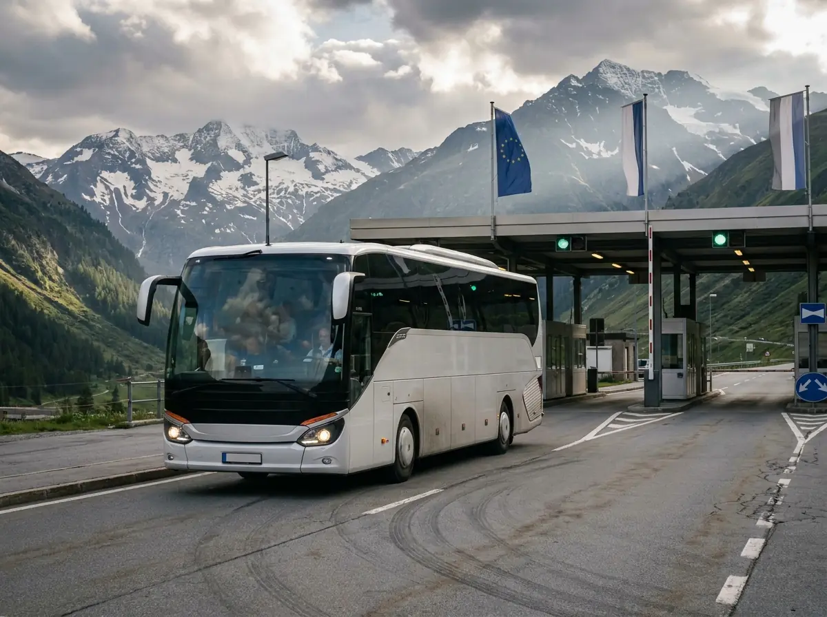 Touring coach passing an Alpine border crossing between two European countries